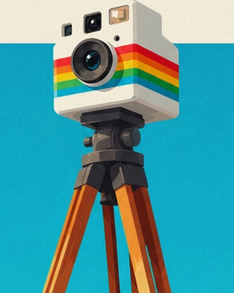 The white camera with rainbow stripes on its wooden tripod