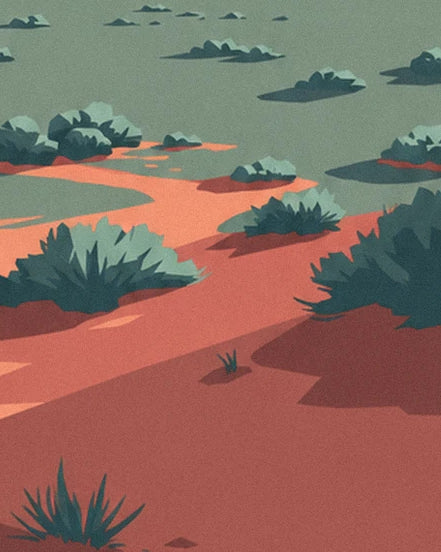 The clumps of dark green sage on the plain's red and orange sand in the evening shade