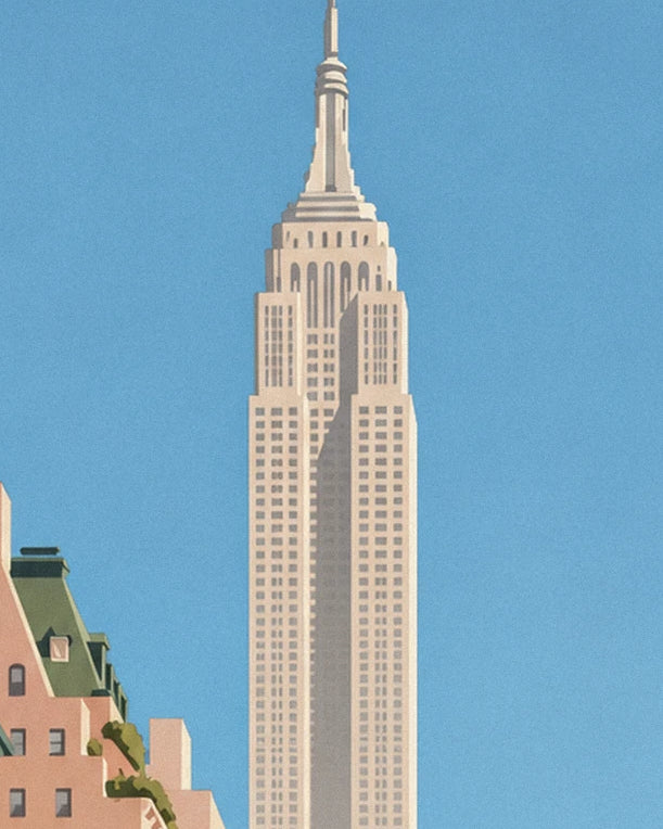The slender outline of the Empire State Building against a blue sky