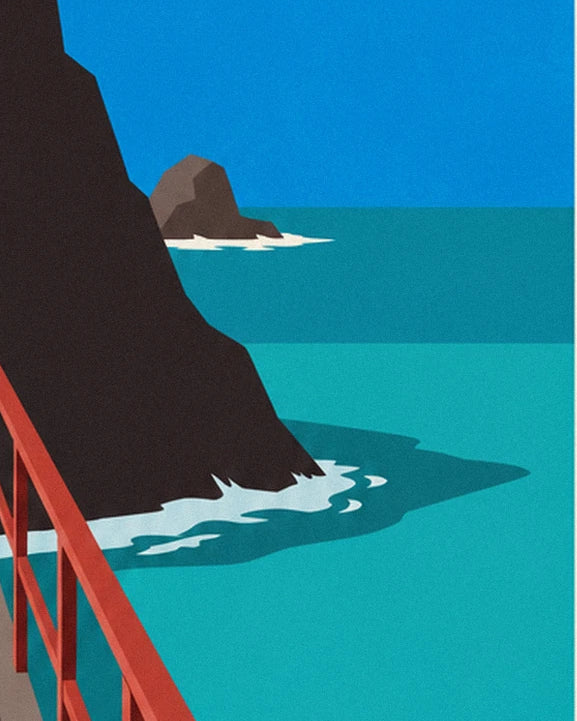 A rocky islet offshore and white foam on the turquoise water, below the red railing