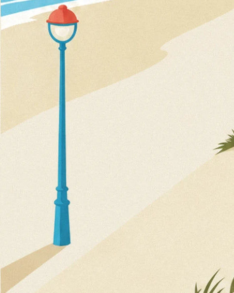 The blue street lamp with its globe and red cap standing in the pale sand of the dune