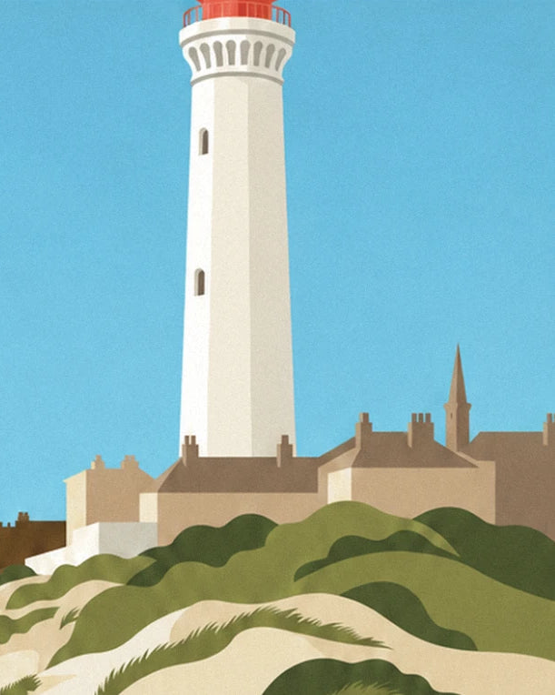 The white lighthouse with its red lantern above the brick houses and dunes