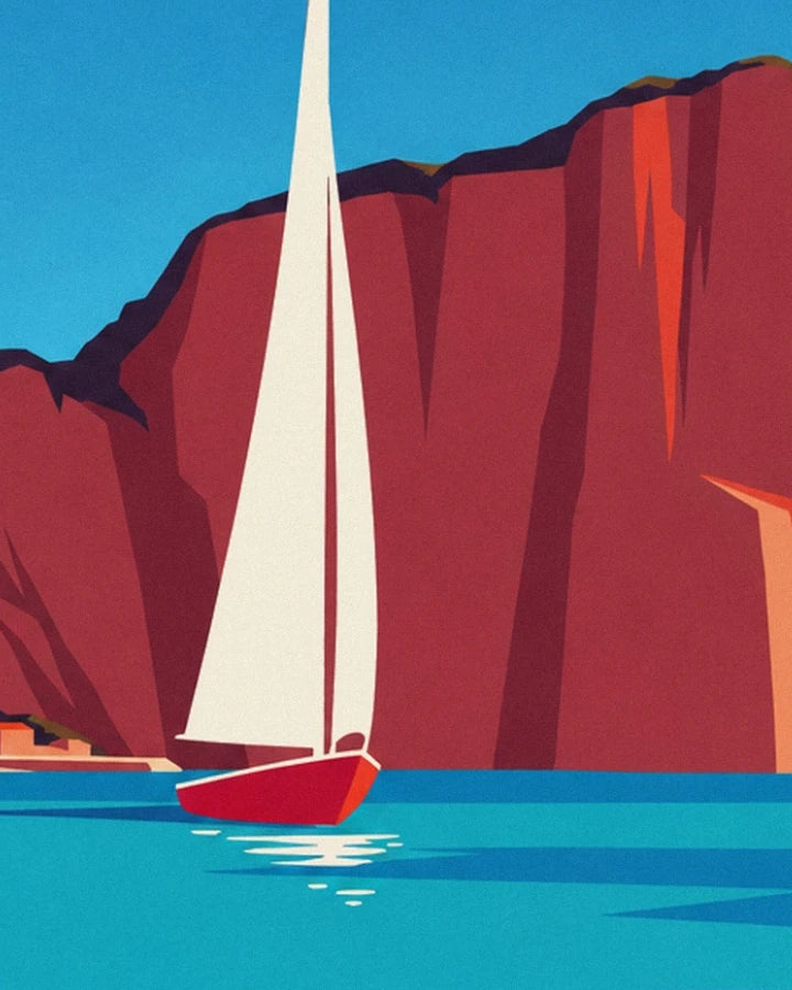 Le voilier à la coque rouge et à la grande voile blanche, au pied des falaises
