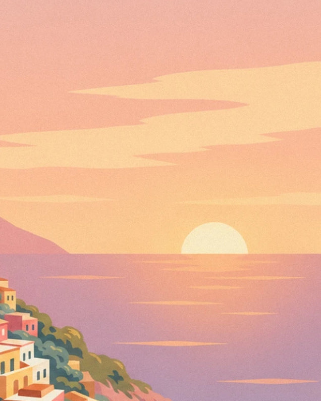 The sun on the horizon over the mauve sea beneath golden clouds in a pink sky