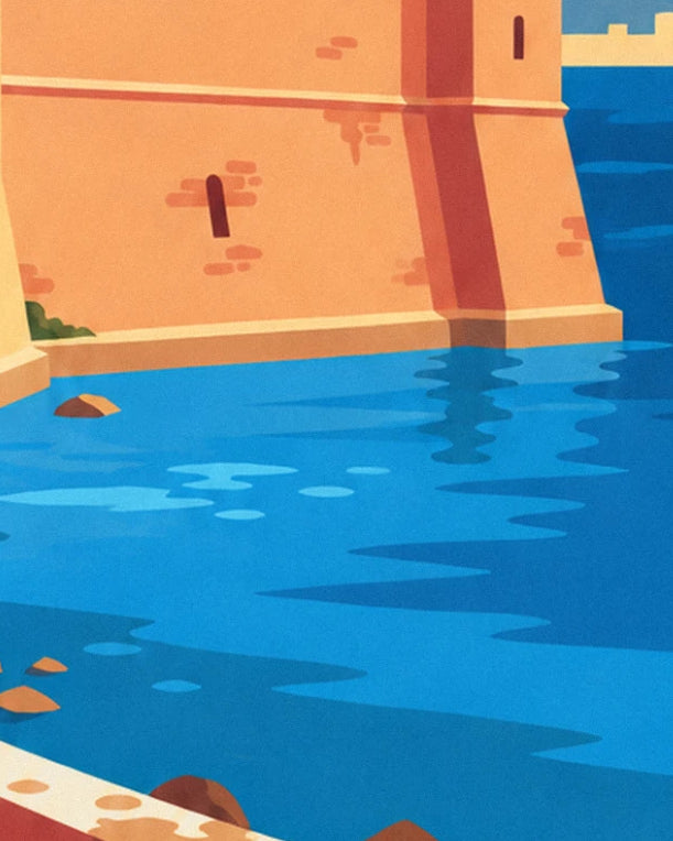 The ochre castle wall dropping into the blue water of the bay, with 1 rock at the edge