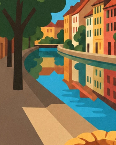Les façades colorées de Colmar reflétées dans le canal bordé d’arbres