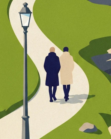 Un couple en manteau marine et beige sur le chemin sinueux, près du lampadaire