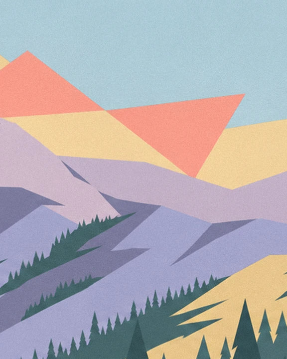 The mauve ridges lined with fir trees beneath a blue sky with coral and golden clouds