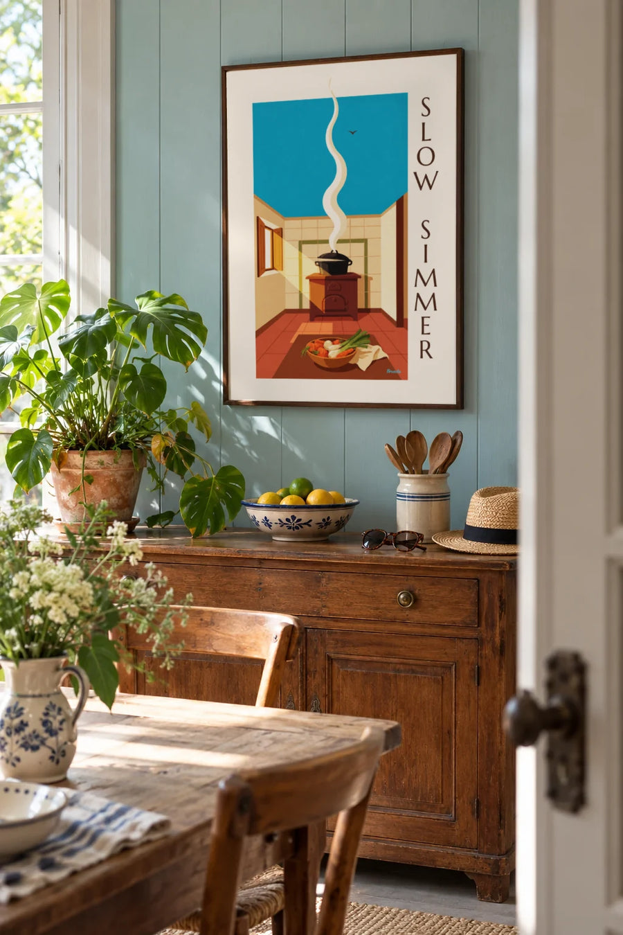 Poster of a steaming pot-au-feu in its cast iron pot: framed on the wall