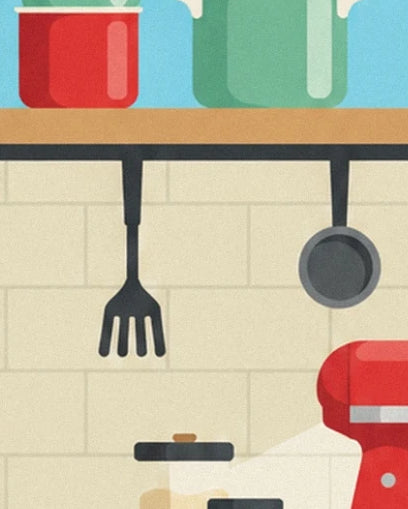 A spatula and frying pan hanging against the tiles beside the red mixer