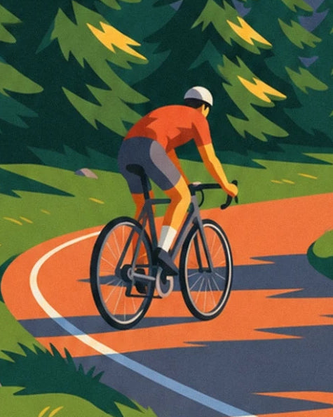The cyclist in an orange jersey on a black bike, rounding a bend lined with fir trees