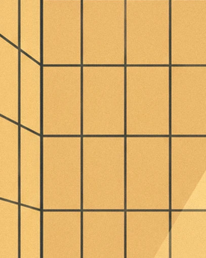 Le carrelage jaune aux joints sombres, traversé par une lumière oblique