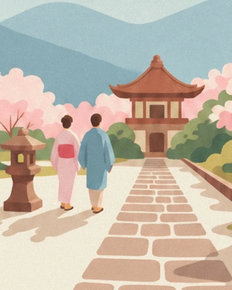 The two walkers in pink and blue kimonos on a paved path facing the pavilion
