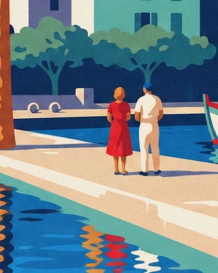 A woman in a red dress and a man in white on the quay, facing the blue harbour basin