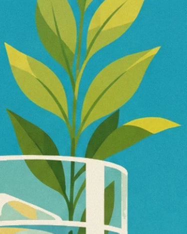 Une branche aux feuilles vertes et jaunes derrière le bord blanc d’un verre