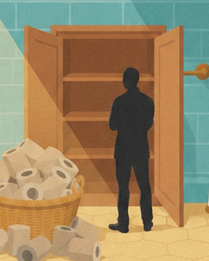 A figure seen from behind in front of an empty cupboard and a basket overflowing with toilet rolls