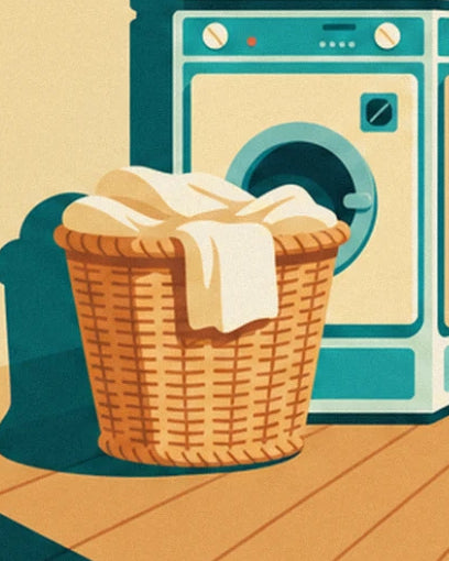 The wicker basket full of white washing in front of the turquoise washing machine