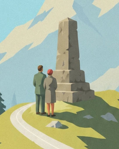 The 2 walkers facing a stone memorial beside the mountain path