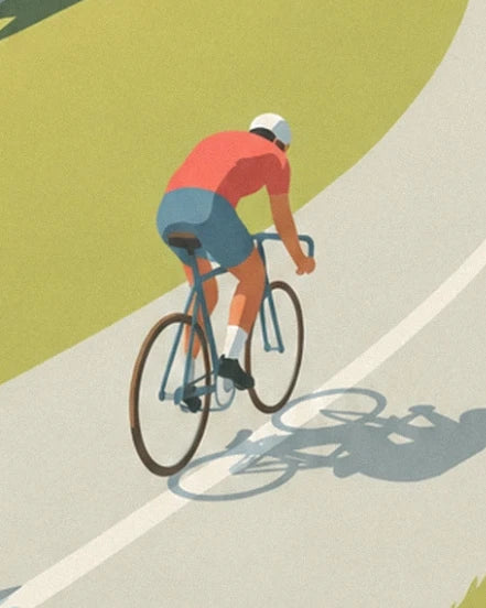The cyclist in a red jersey and their bike on the mountain pass road, with their cast shadow