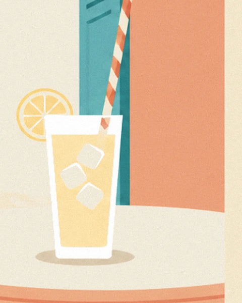The glass of lemonade with its 3 ice cubes and lemon slice, on the round table