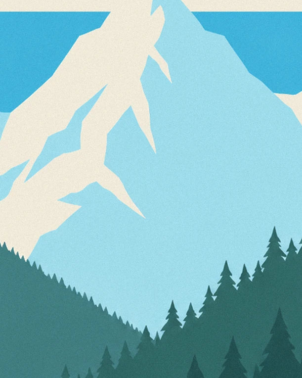 The snow-covered peaks of the Alpes above slopes wooded with fir trees