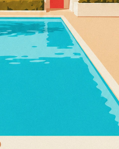 The turquoise pool with bright reflections, bordered by a beige terrace and hedges