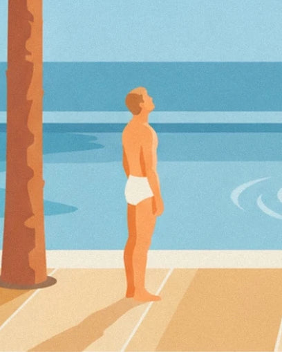 A man in white trunks beside the blue swimming pool, near a palm trunk