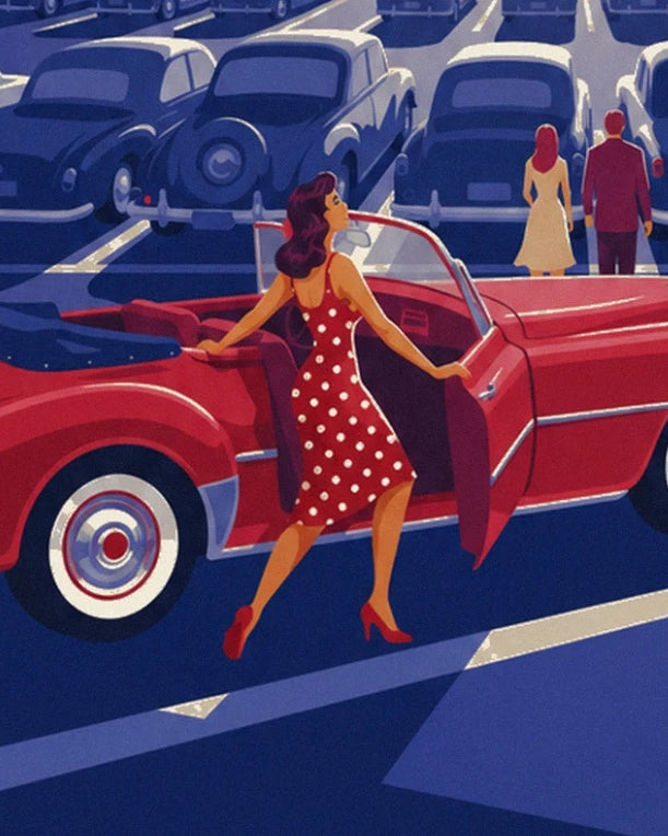 A pin-up in a red dress with white polka dots beside the door of the red convertible