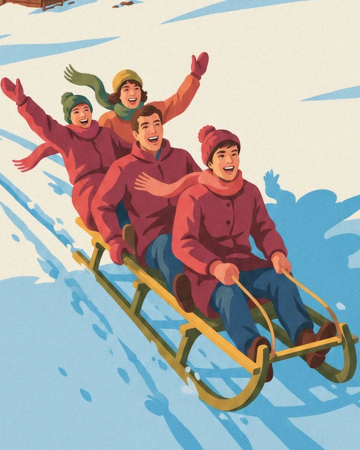 The family in hats and red coats on a wooden sledge in the snow