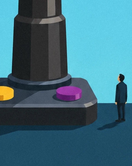 A figure facing the giant joystick base with its yellow and purple buttons