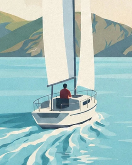 Le voilier blanc, son navigateur en rouge et son sillage sur l’eau turquoise