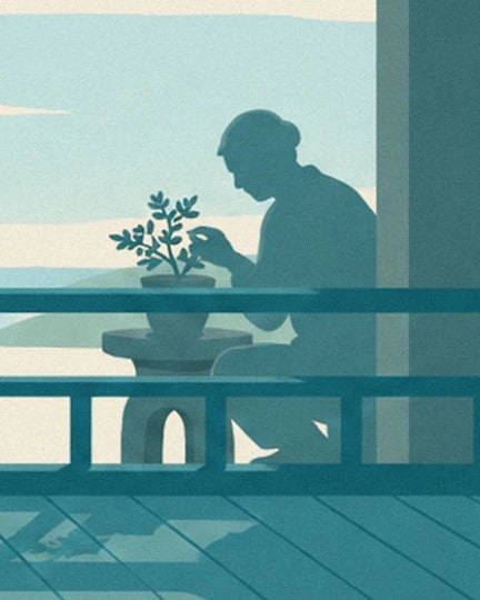 La silhouette assise devant un petit arbre en pot, derrière la rambarde turquoise