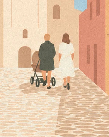 The 2 people seen from behind walking with a pushchair along the village's cobbled lane