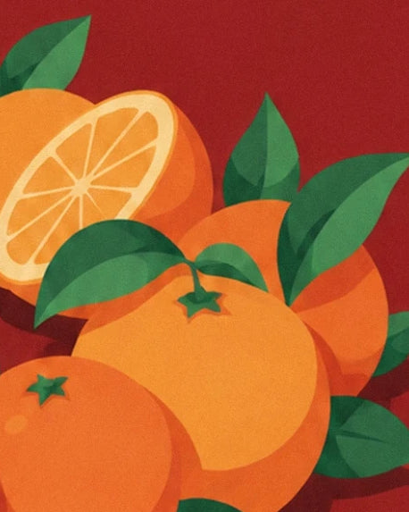 Un bouquet d’oranges aux feuilles vertes, avec une moitié d’orange en arrière-plan