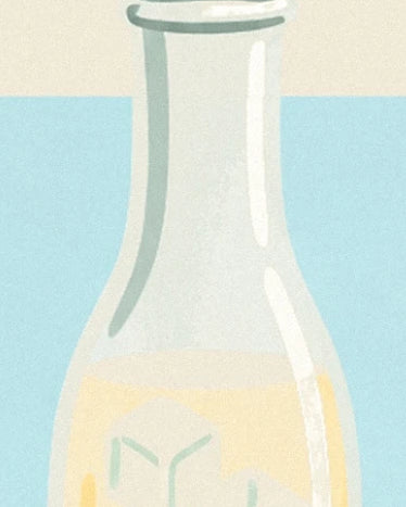 The slender neck of the glass carafe and its yellow lemonade against a light blue background
