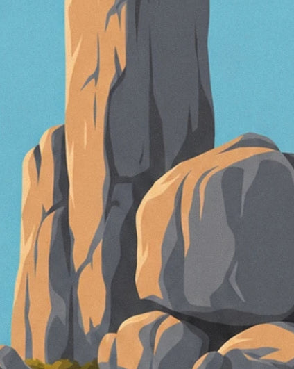Tall grey and ochre rock faces rising against the blue sky