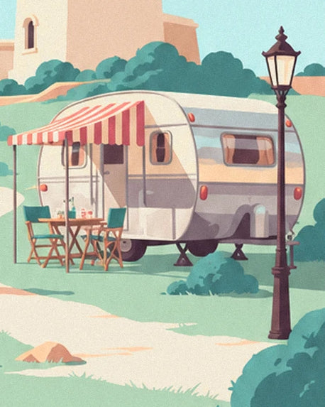 The caravan with its red and white striped awning and camping chairs