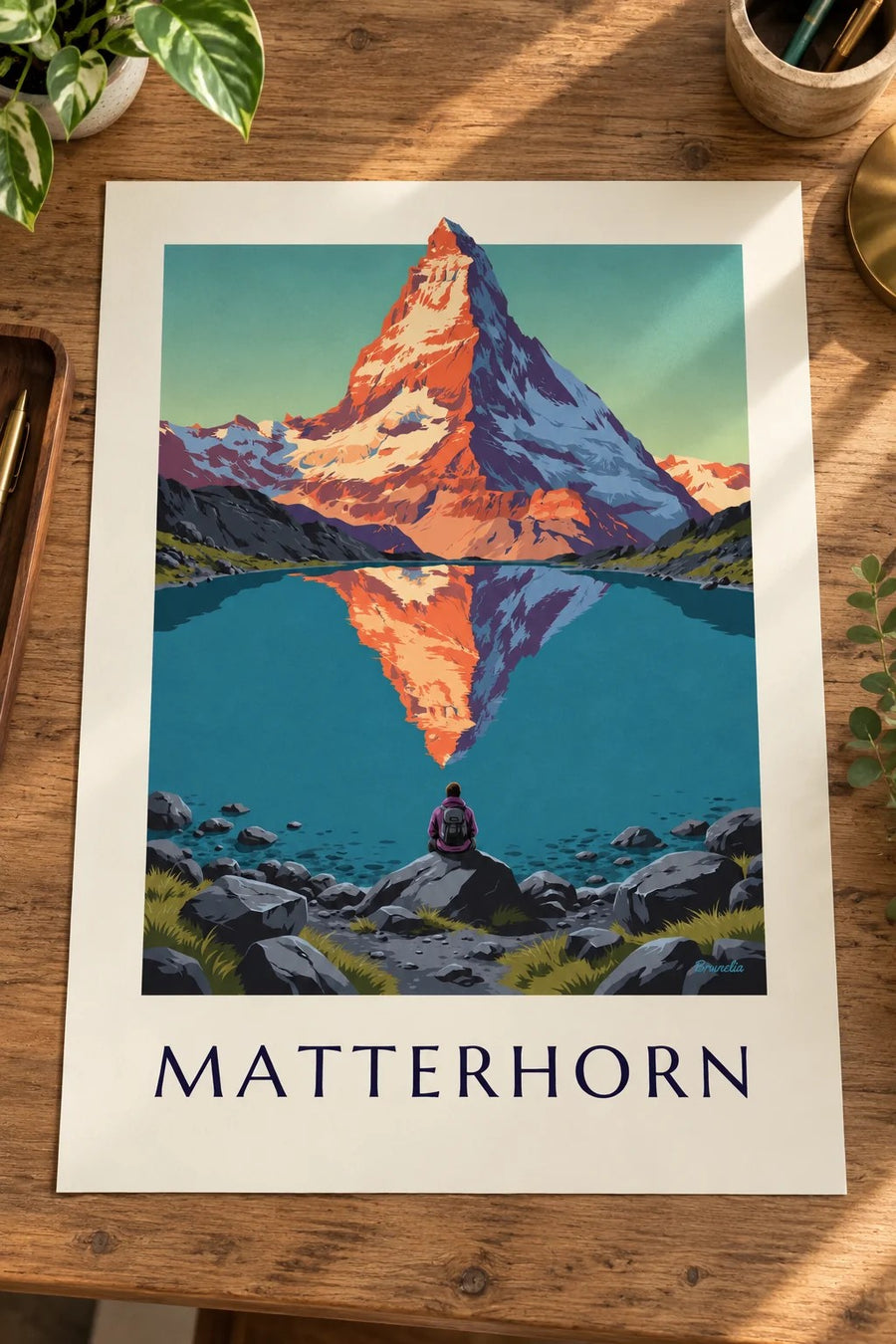 Matterhorn at sunset reflected in an alpine lake poster: placed on a table