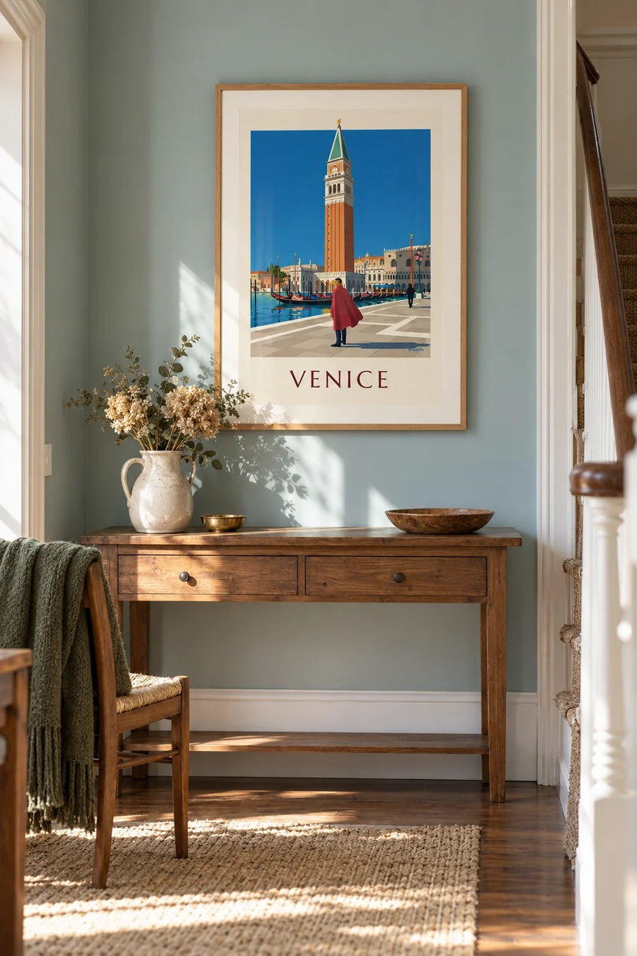 Masked man in red cape and St Mark’s Campanile poster: framed on the wall