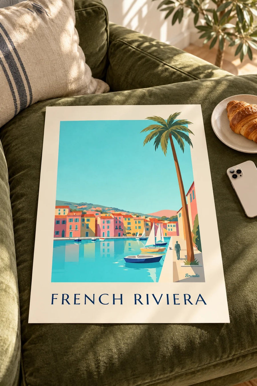 Small French Riviera harbor with houses and sailboats poster: resting on a table