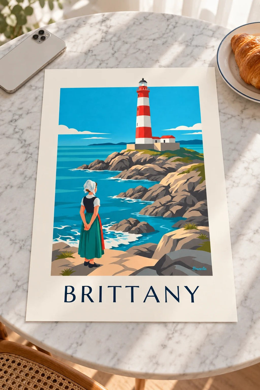 Breton woman in lace headdress and red and white lighthouse poster: resting on a table