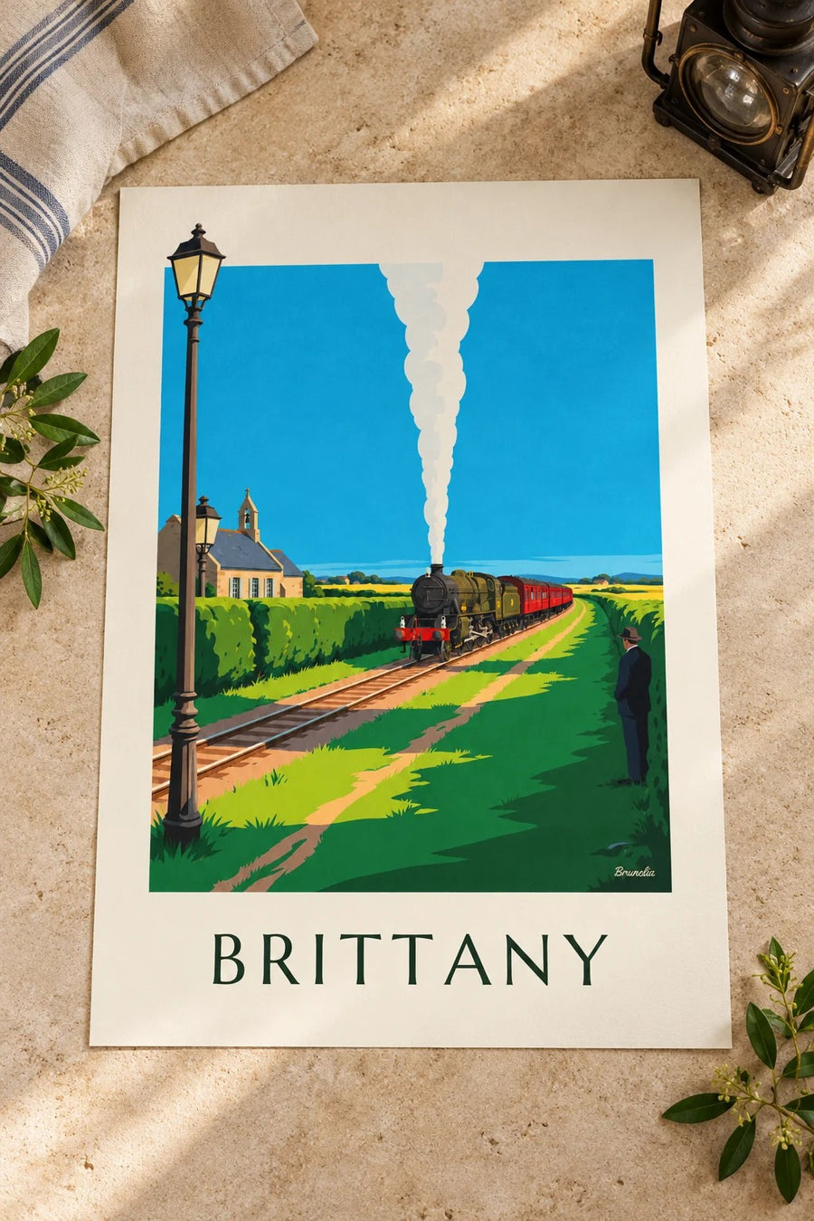 Steam locomotive in the Brittany countryside poster: placed on a table