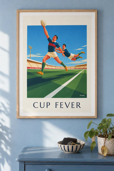Poster of a rugby player running with the ball facing a tackler: framed on the wall