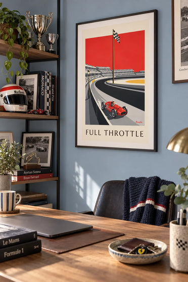 Poster of a Grand Prix race car speeding around the track: framed on the wall