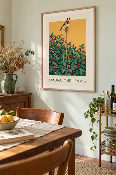 Poster of a goldfinch perched on a teasel above the berries: framed on the wall