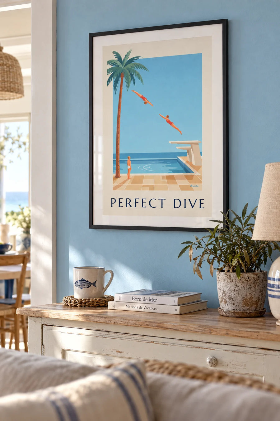Poster of a diver mid-dive above a swimming pool: framed on the wall