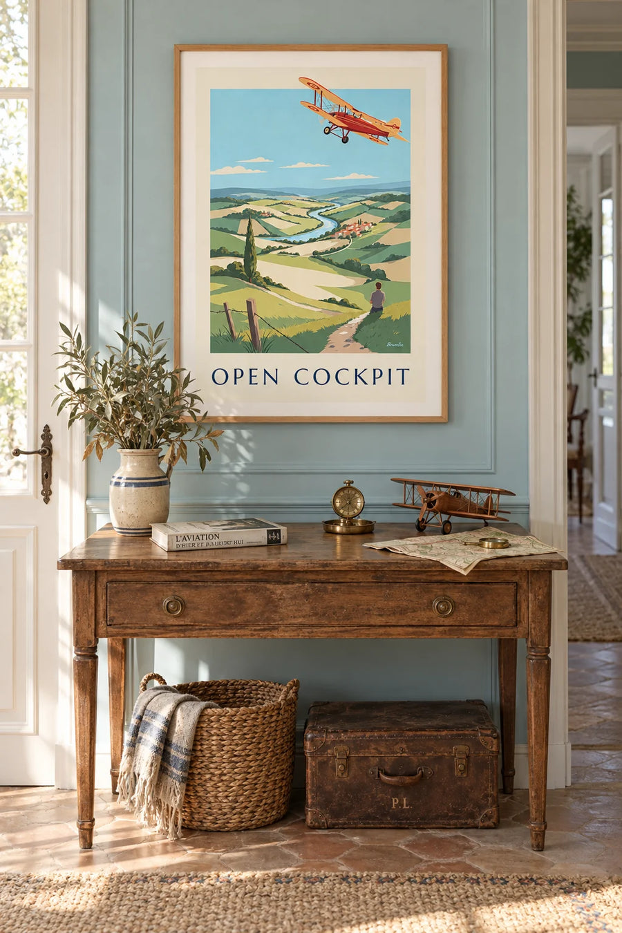 Biplane poster, a plane in flight over the countryside: framed on the wall
