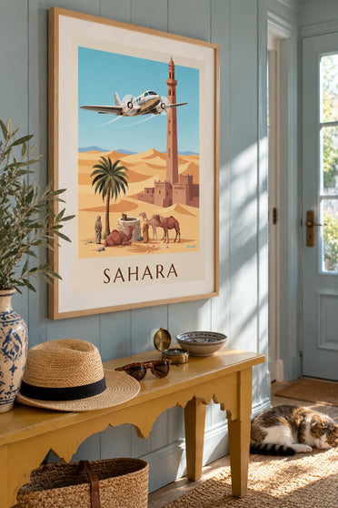 Affiche avion trimoteur survolant une oasis et les dunes du Sahara : encadrée au mur