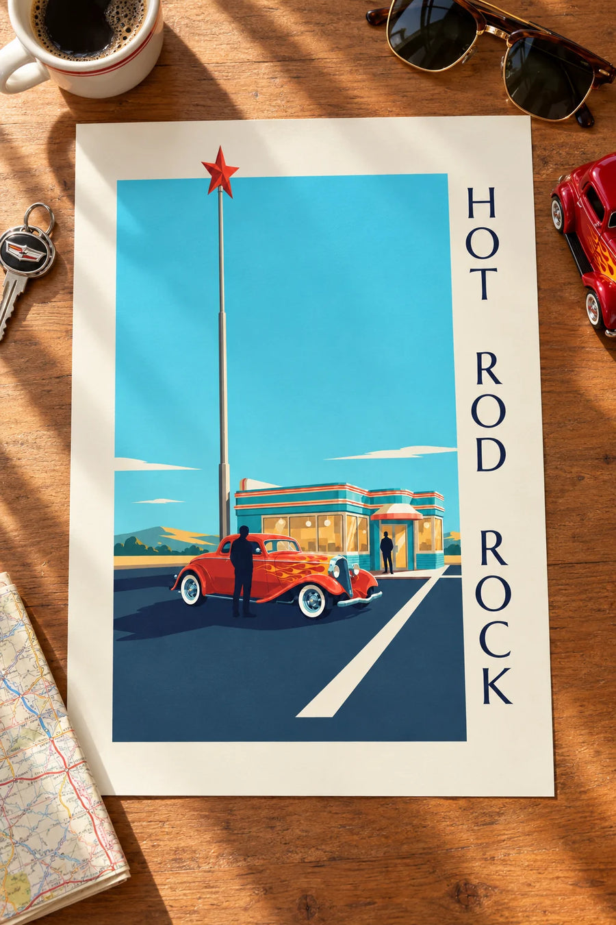 Affiche voiture hot rod devant un diner rock and roll : posée sur une table