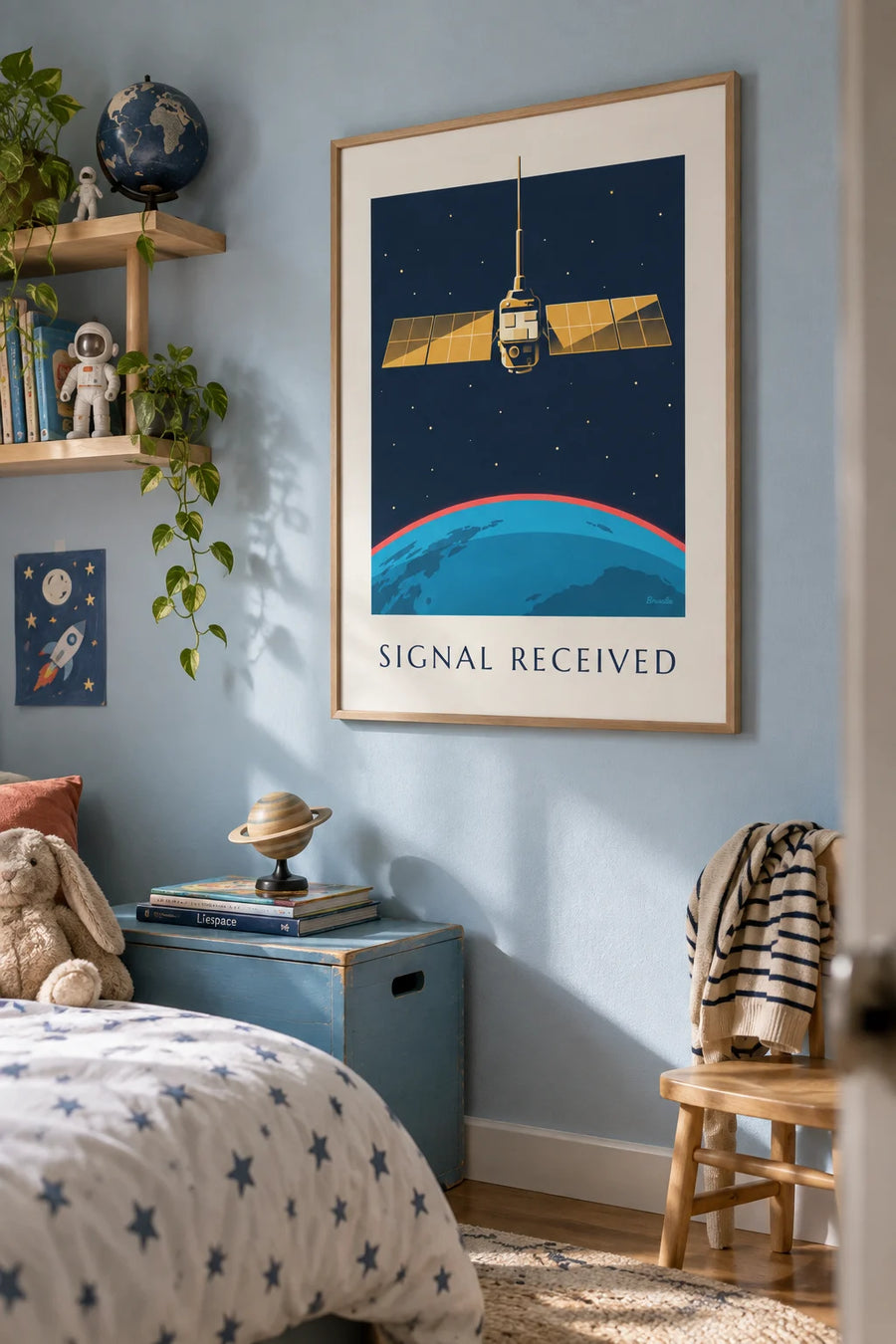 Satellite in space above the Earth poster: framed on the wall